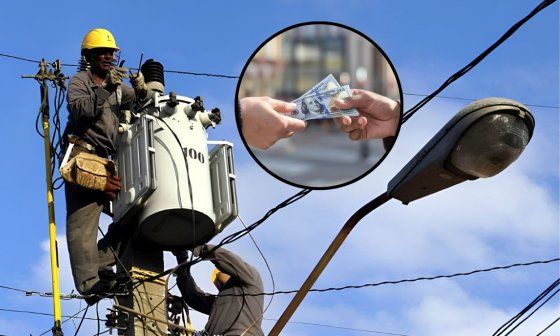 Operarios de la Unión Eléctrica de Cuba trabajando en un transformador.