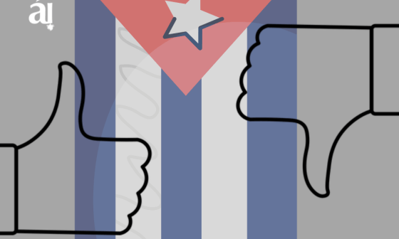 Bandera cubana entre manos diciendo "sí" y "no".