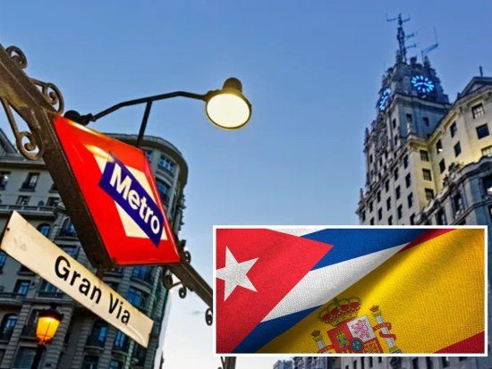 Metro de la Gran Vía en Madrid y banderas de Cuba y España